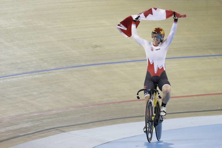 Canada's Monique Sullivan celebrates after winning the women's keirin track cycling competition at the Pan Am Games in Milton, Ontario, Friday, July 17, 2015. Sullivan won the gold medal. (AP Photo/Felipe Dana)