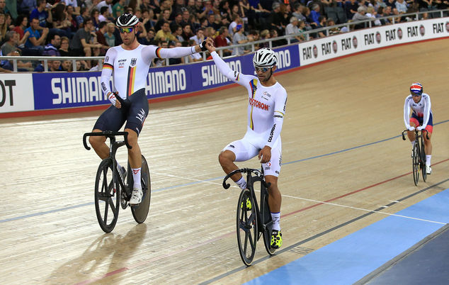 Colombia's Fernando Gaviria Rendon, right, celebrates winning the gold medal in the Men's Omnium alongside silver medalist Germany's Roger Kluge, at the World Track Cycling championships at Lee Valley VeloPark, in London, Saturday March 5, 2016. (John Walton/PA via AP) UNITED KINGDOM OUT NO SALES NO ARCHIVE