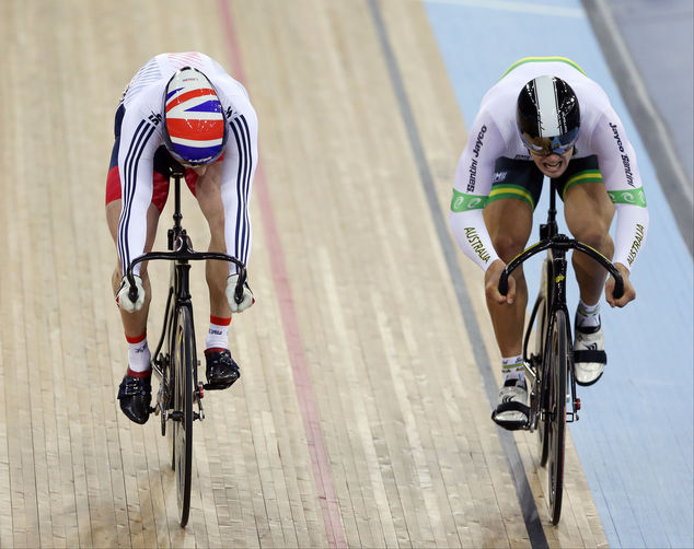 Great Britain's Jason Kenny, left, races against Australia's Matthew Glaetzer, in the Men's Sprint final of the World Track Cycling championships at Lee Valley VeloPark, in London, Saturday March 5, 2016. (Tim Goode/PA via AP) UNITED KINGDOM OUT NO SALES NO ARCHIVE